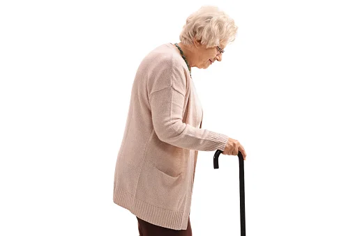 Elderly woman with a cane isolated on white background
